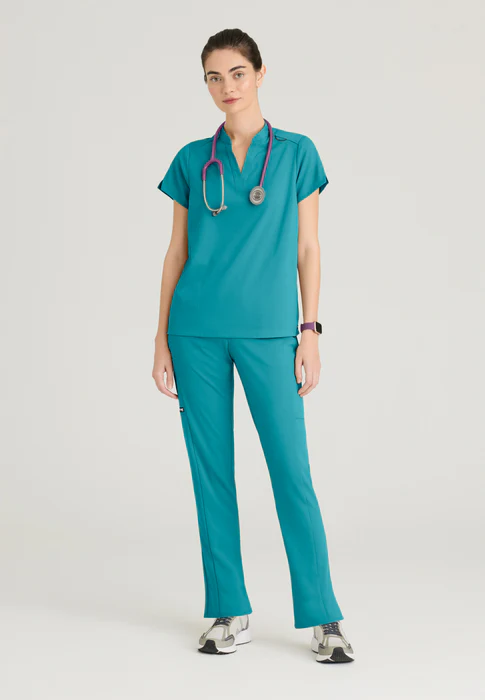 Blusa médica Avery de spandex elástico con dos bolsillos y cuello con banda, de Grey's Anatomy