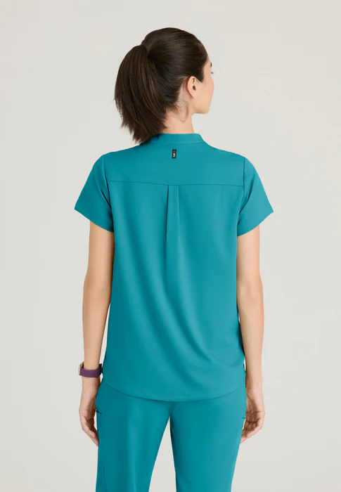 Blusa médica Avery de spandex elástico con dos bolsillos y cuello con banda, de Grey's Anatomy
