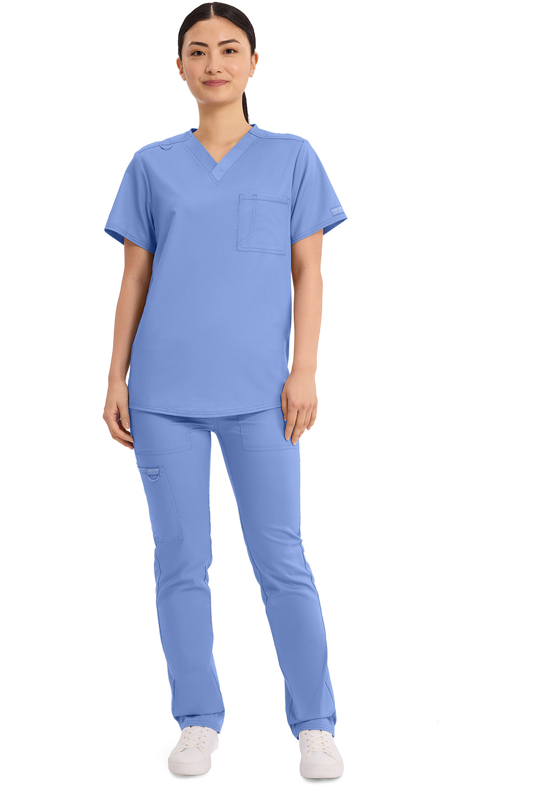 Cherokee Workwear Revolution Unisex, blusa quirúrgica de cuello en V con bolsillo y diseño para meter por dentro