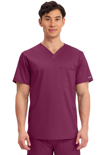 Cherokee Workwear Revolution Unisex, blusa quirúrgica de cuello en V con bolsillo y diseño para meter por dentro